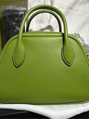Coach dark lime Borough bowling bag. Handles is 2.75 Crossbody strap is 21.50